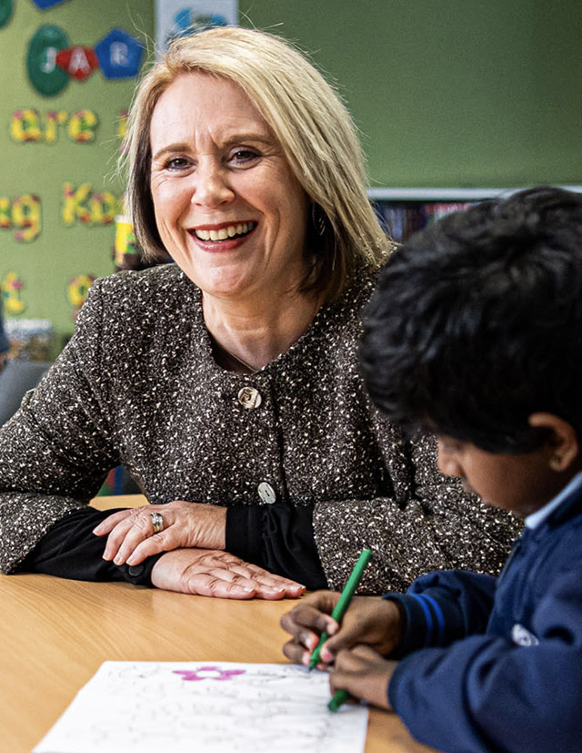 Holy Trinity Catholic Primary School Granville dedicated principal Shauna Nash smiling at student