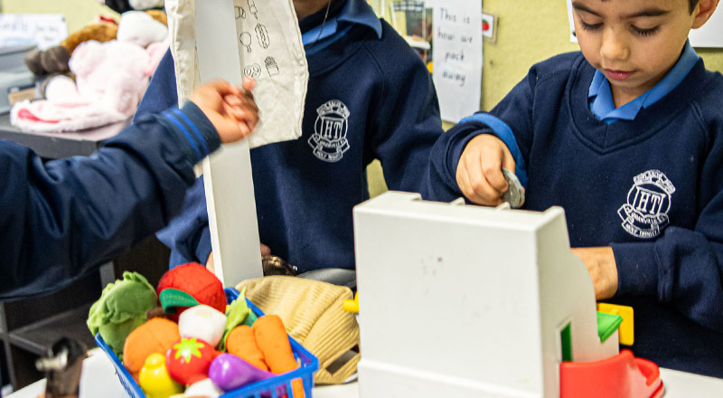 Holy Trinity Catholic Primary School Granville students playing in a toy grocery shop