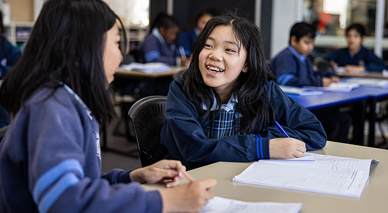 Holy Trinity Catholic Primary School Granville students smiling at each other