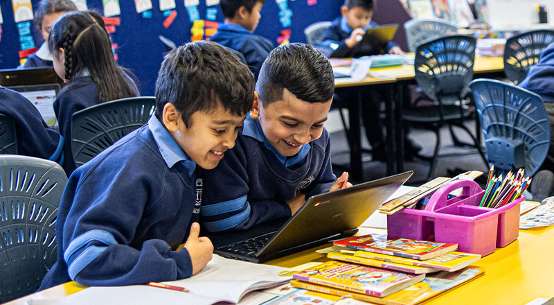 Holy Trinity Catholic Primary School Granville students sitting at desk