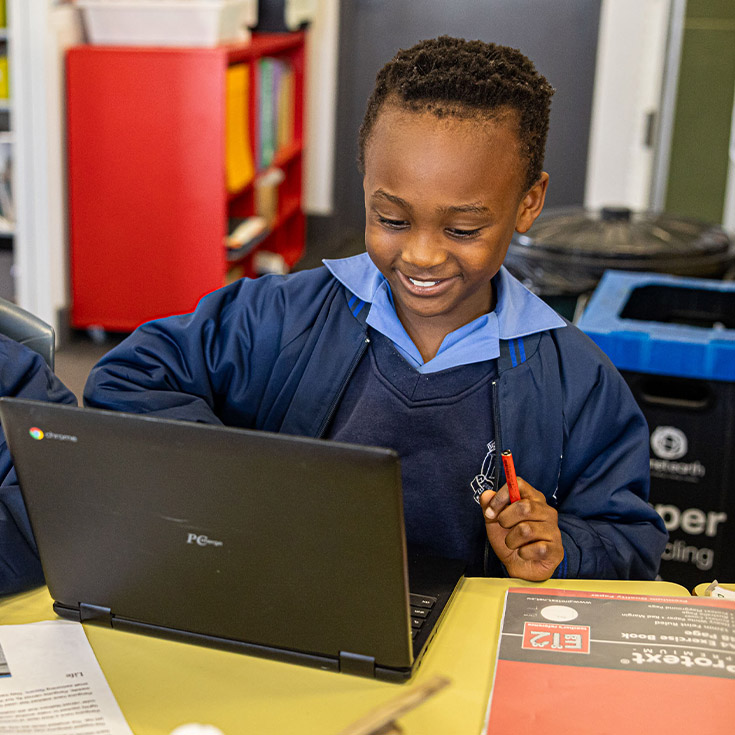 Holy Trinity Catholic Primary School Granville student learning on laptop