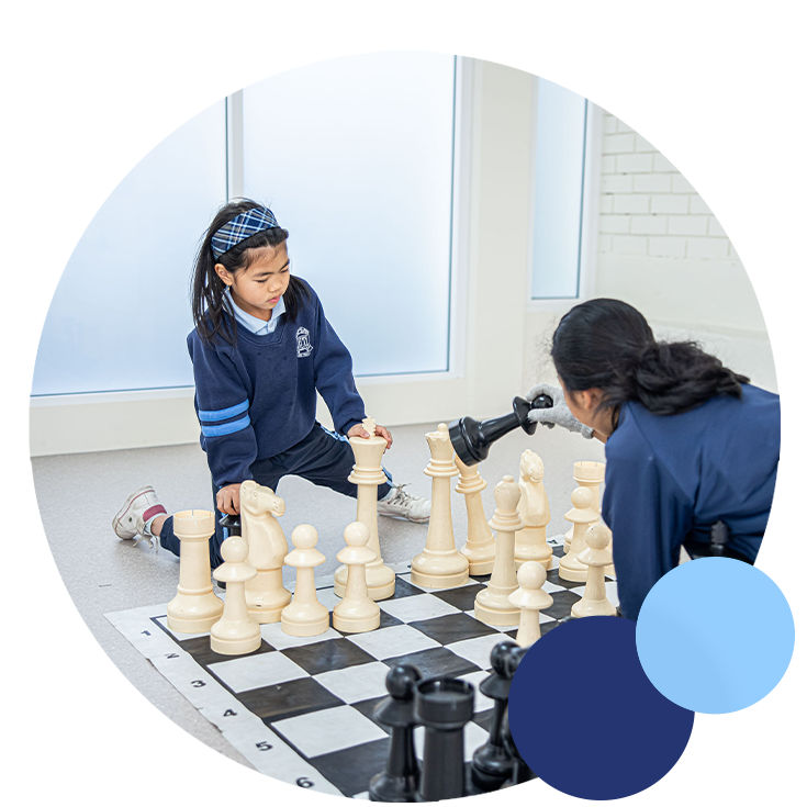 Holy Trinity Catholic Primary School Granville students playing chess on large chess board